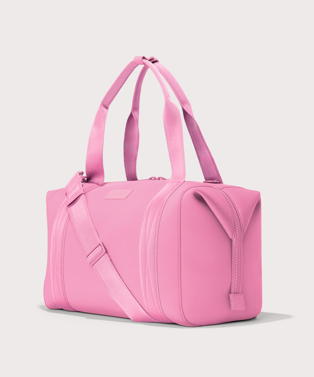 Dagne Dover Large Landon Carryall in a true bubble gum pink seen from an angle.