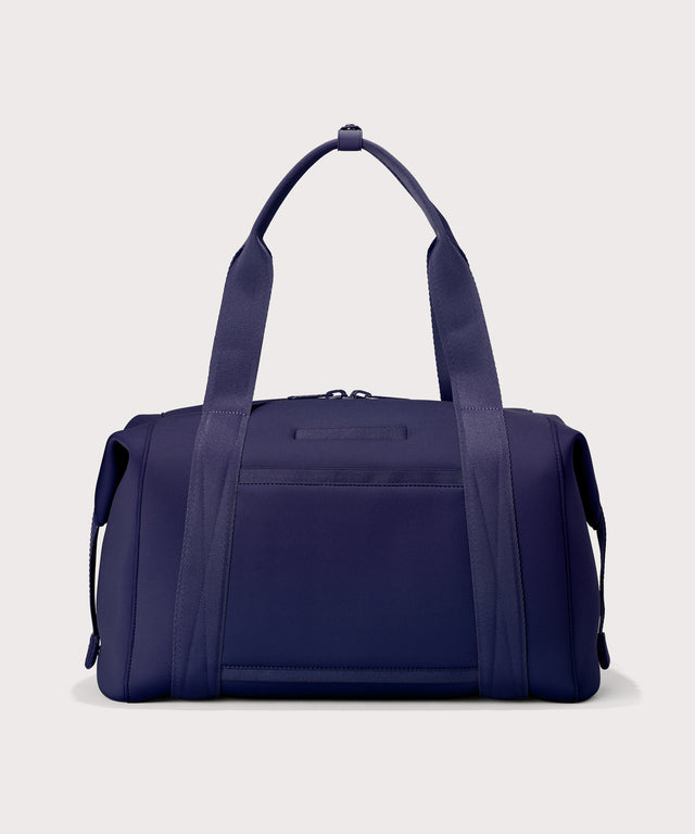Large Landon Carryall in a jewel-toned, deep blue with strong purple undertones, displaying an exterior phone pocket
