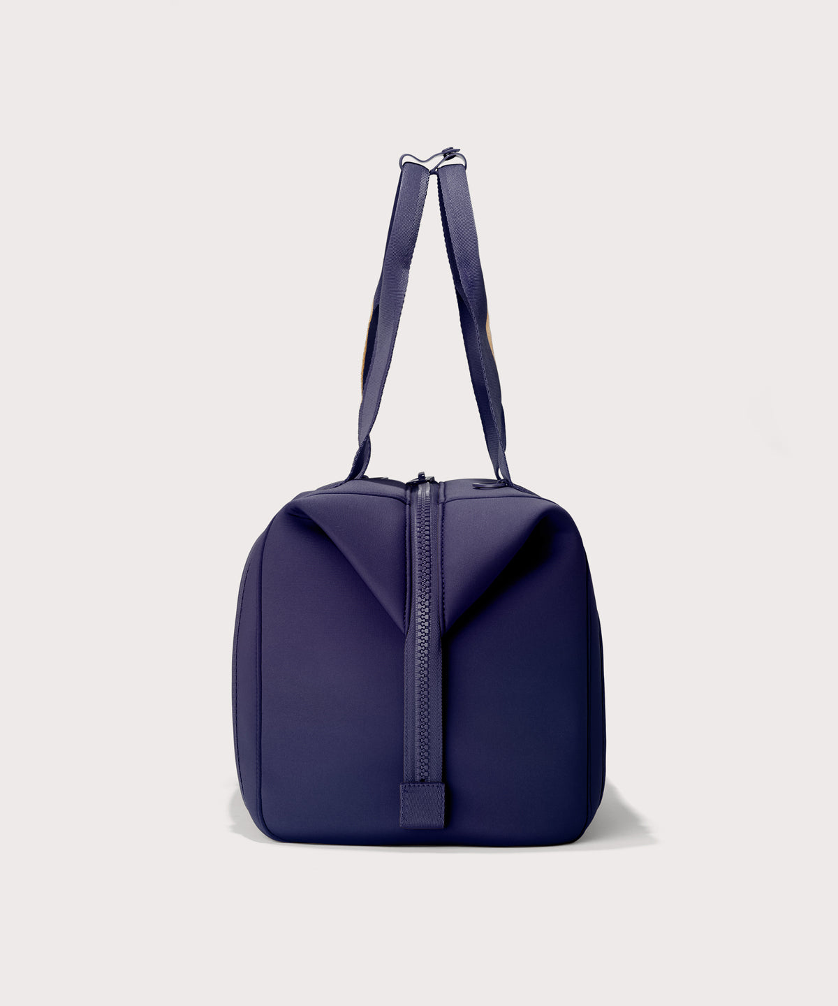 Large Landon Carryall in a jewel-toned, deep blue with strong purple undertones, side view
