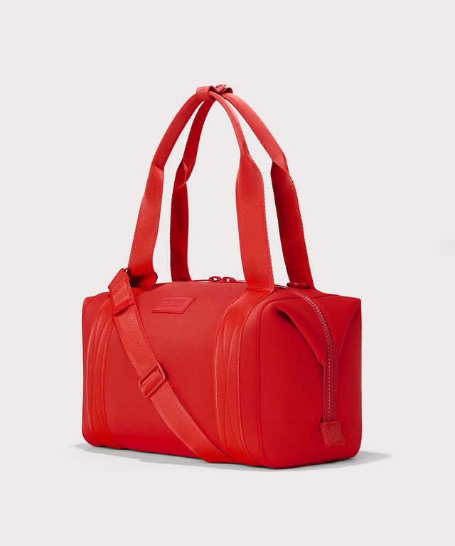 Dagne Dover Medium Landon Carryall in a fiery, saturated red leaning toward orange seen from an angle.