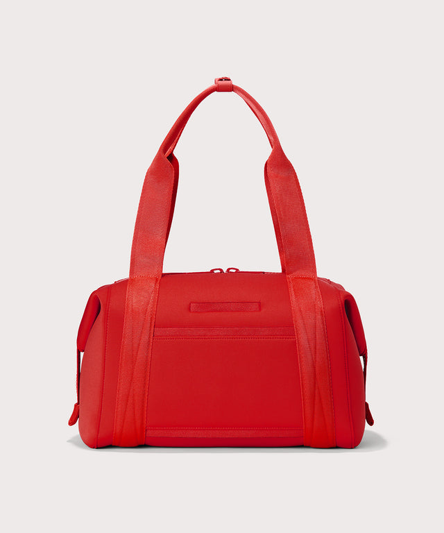 Dagne Dover Medium Landon Carryall in a fiery, saturated red leaning toward orange seen from the back.