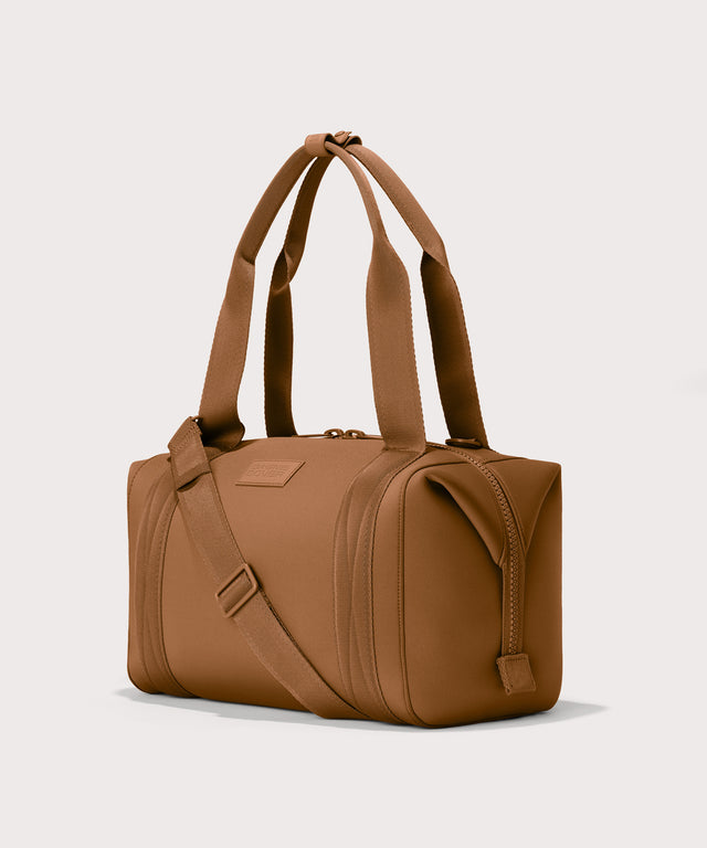 Medium Landon Carryall in a a saturated, warm medium-brown with burnt orange undertones, side angle view
