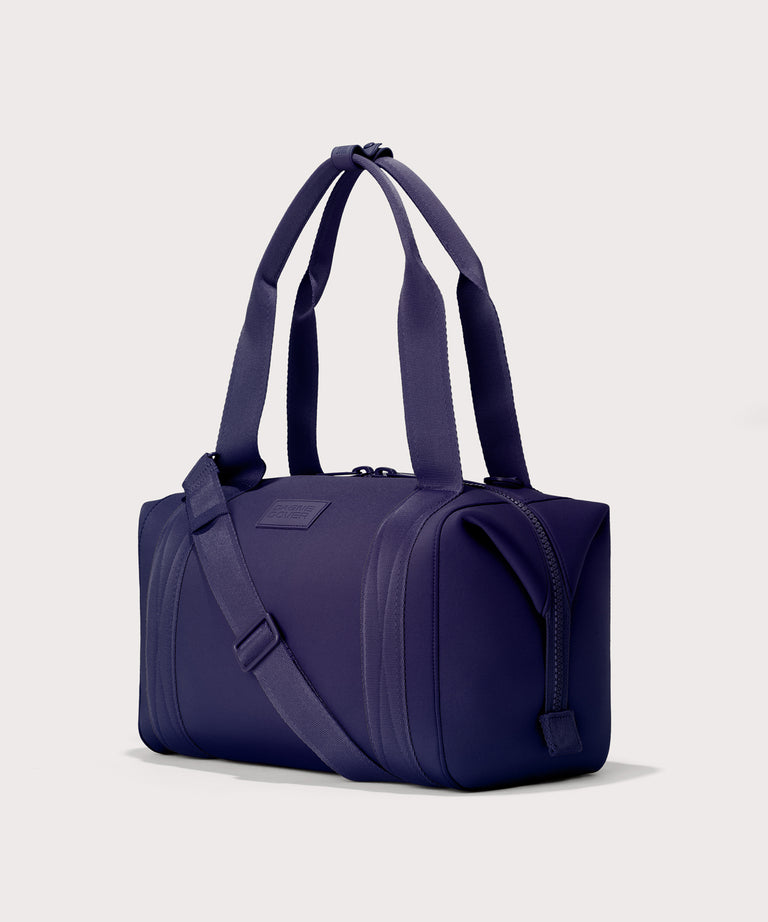 Medium Landon Carryall in a jewel-toned, deep blue with strong purple undertones, side angle view
