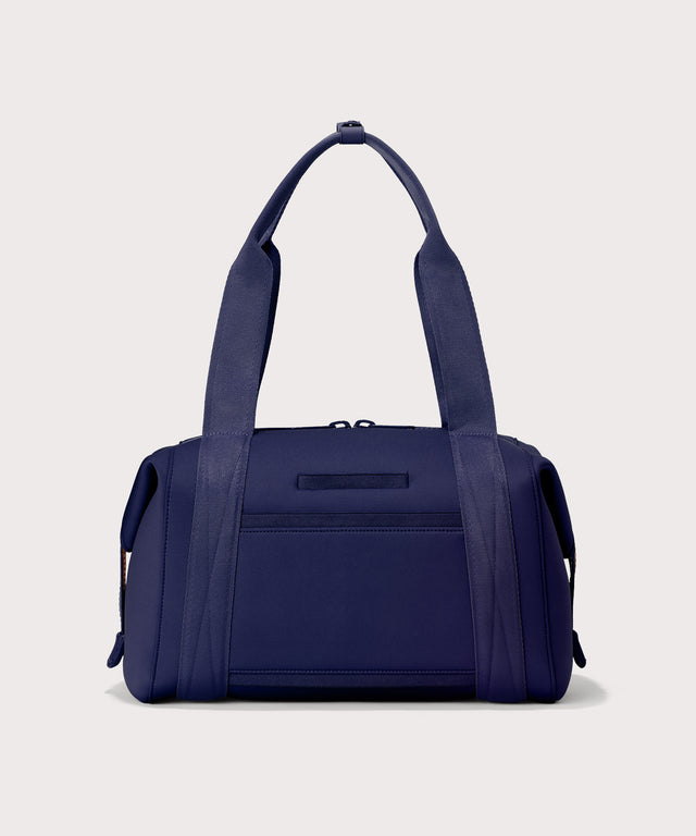 Medium Landon Carryall in a jewel-toned, deep blue with strong purple undertones, displaying an exterior phone pocket
