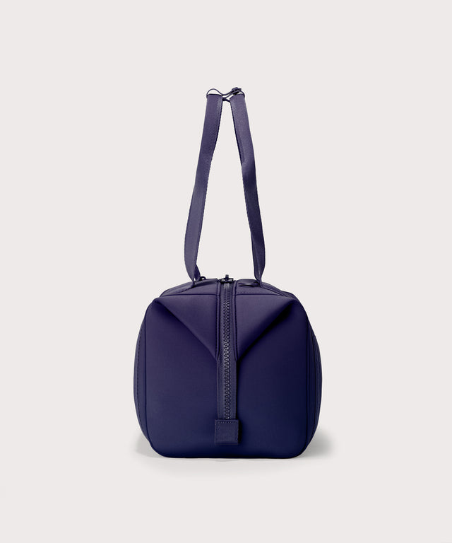 Medium Landon Carryall in a jewel-toned, deep blue with strong purple undertones, side view
