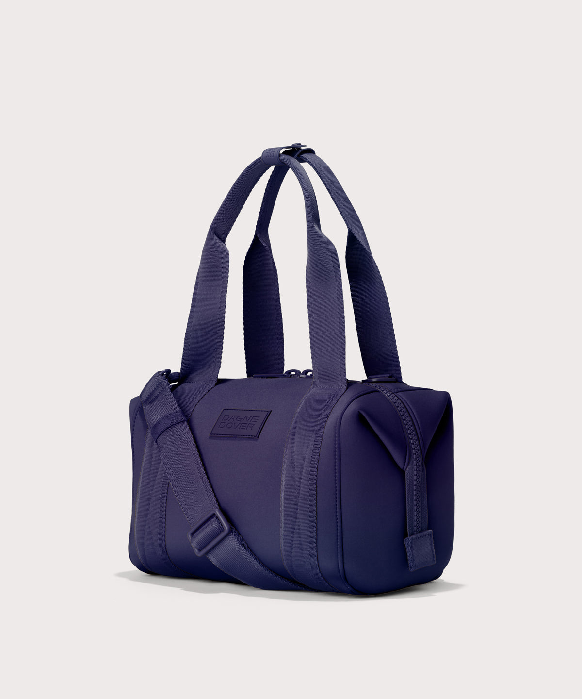 Small Landon Carryall in a jewel-toned, deep blue with strong purple undertones, side angle view
