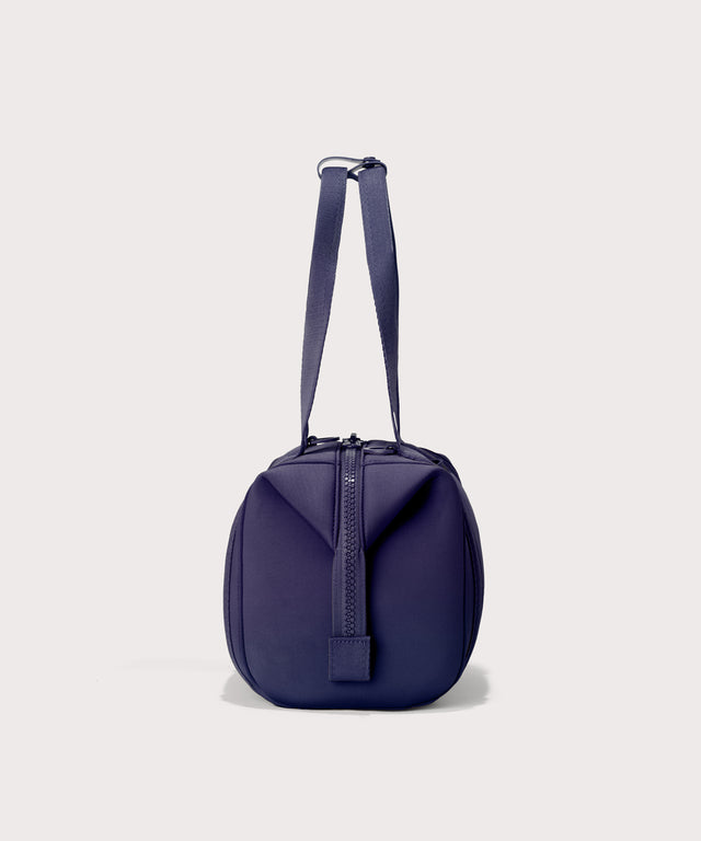 Small Landon Carryall in a jewel-toned, deep blue with strong purple undertones, side view
