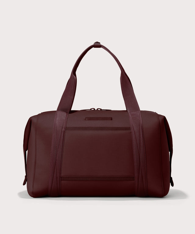 Dagne Dover Extra Large Landon Carryall in a deep brown with purple undertones seen from the back.
