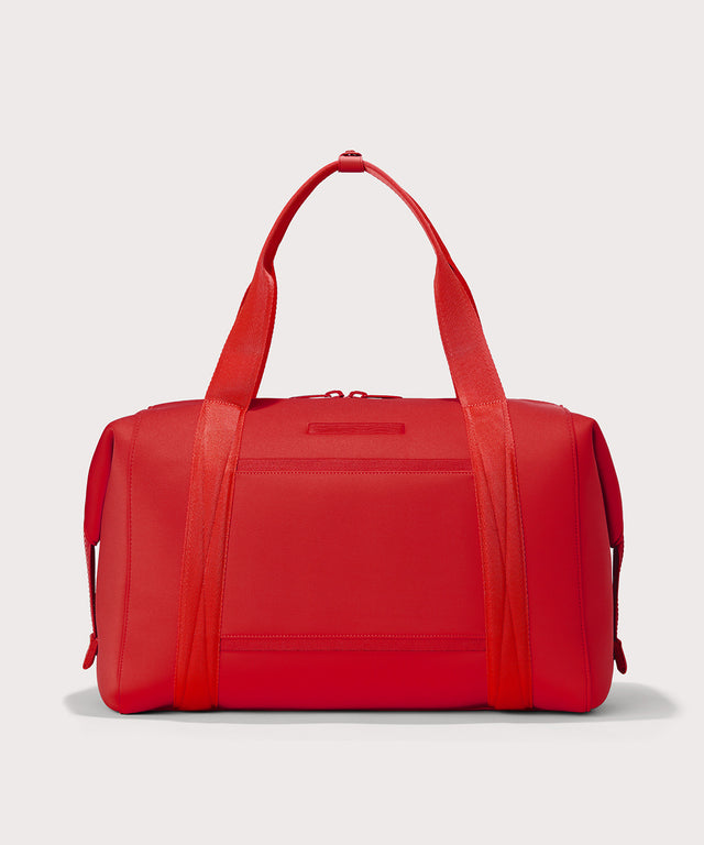 Dagne Dover Extra Large Landon Carryall in a fiery, saturated red leaning toward orange seen from the back.