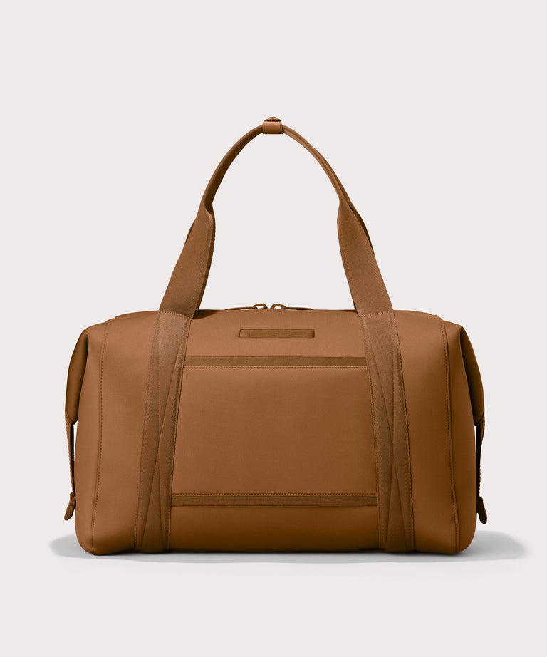Extra Large Landon Carryall in a a saturated, warm medium-brown with burnt orange undertones, displaying an exterior phone pocket
