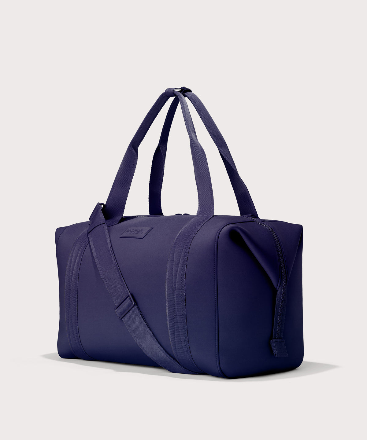  Extra Large Landon Carryall in a jewel-toned, deep blue with strong purple undertones, side angle view

