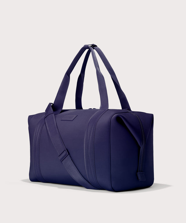  Extra Large Landon Carryall in a jewel-toned, deep blue with strong purple undertones, side angle view
