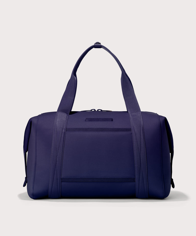  Extra Large Landon Carryall in a jewel-toned, deep blue with strong purple undertones, displaying an exterior phone pocket
