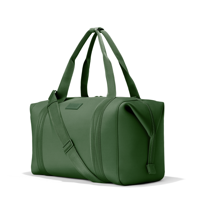 Dagne Dover extra large Landon Carryall in a rich, classic forest green, seen from an angle.