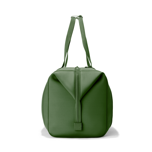 Dagne Dover extra large Landon Carryall in a rich, classic forest green, seen from the side.