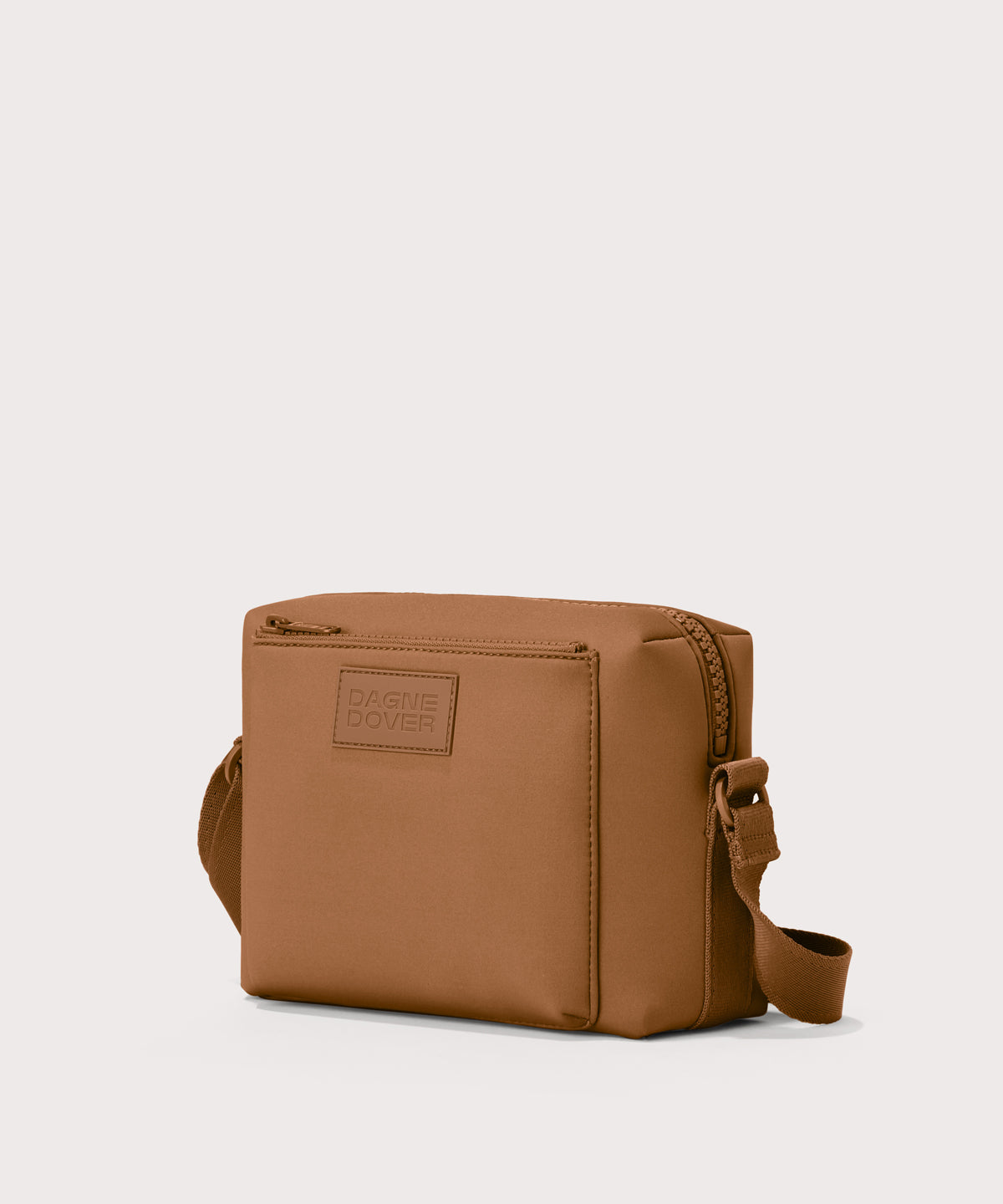 Micah crossbody bag in a saturated, warm medium-brown with burnt orange undertones, side angle view
