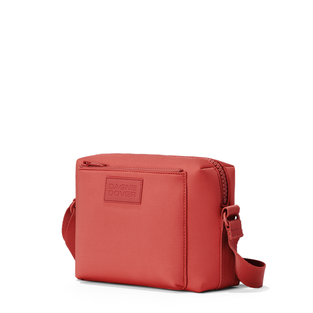 Dagne Dover Micah Crossbody in a poppy, vintage wash red seen from an angle.
