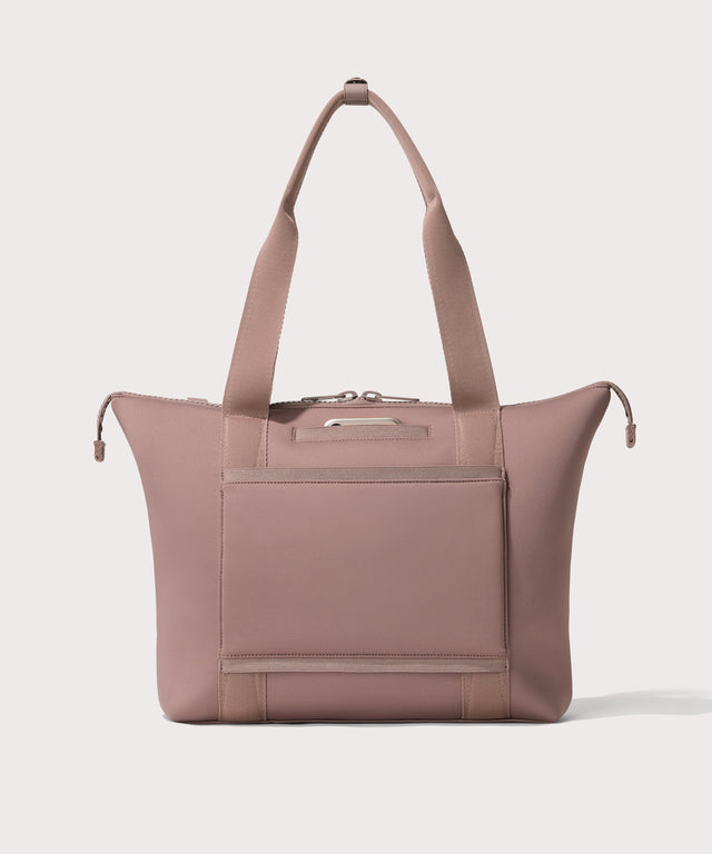 Tote  in a  pink seen from the back view showing phone pocket.
