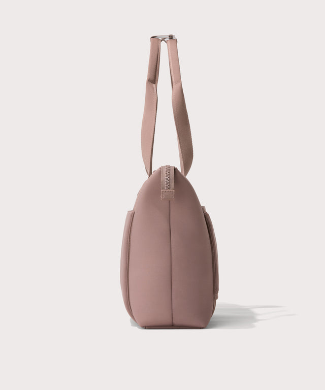 Tote  in a pink seen from the side view.
