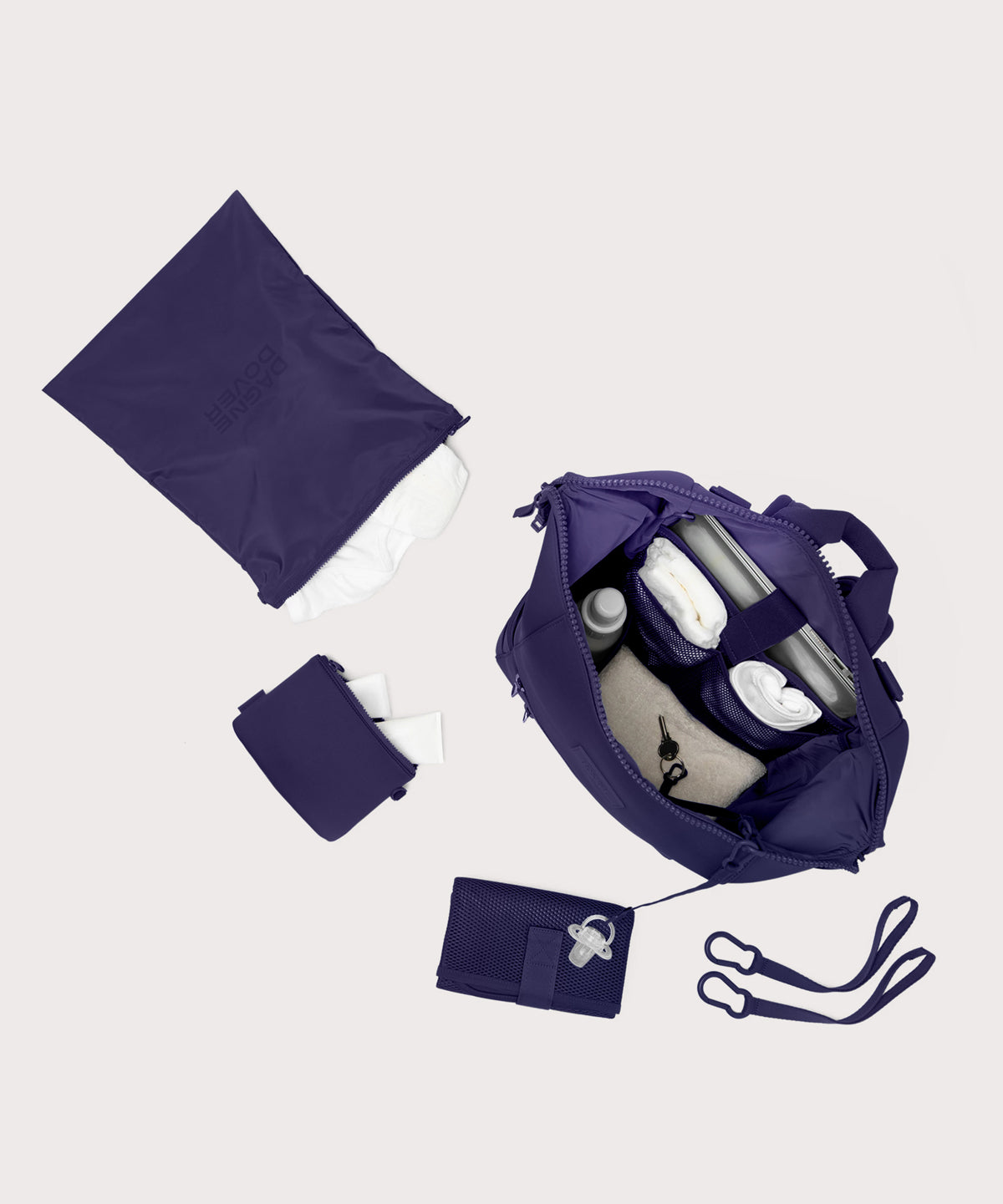 Large Indi backpack in a jewel-toned, deep blue with strong purple undertones. unzipped, top down view. 
