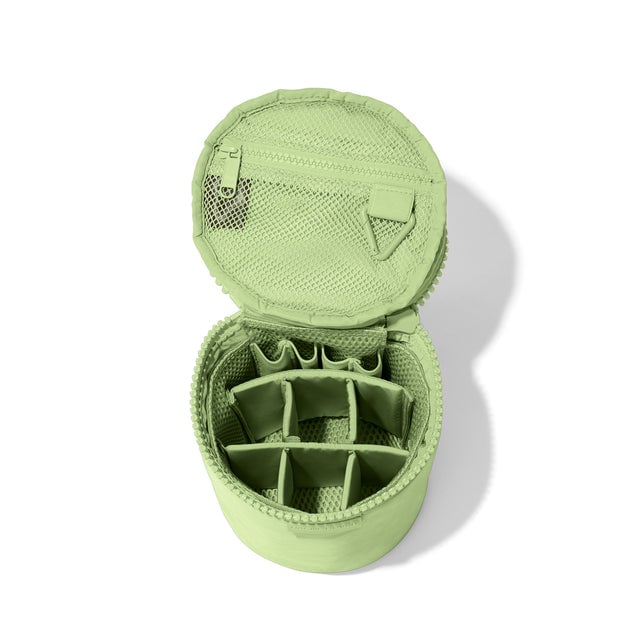 Dagne Dover large Mila Toiletry Pouch in matcha green unzipped with the 6 adjustable compartments.