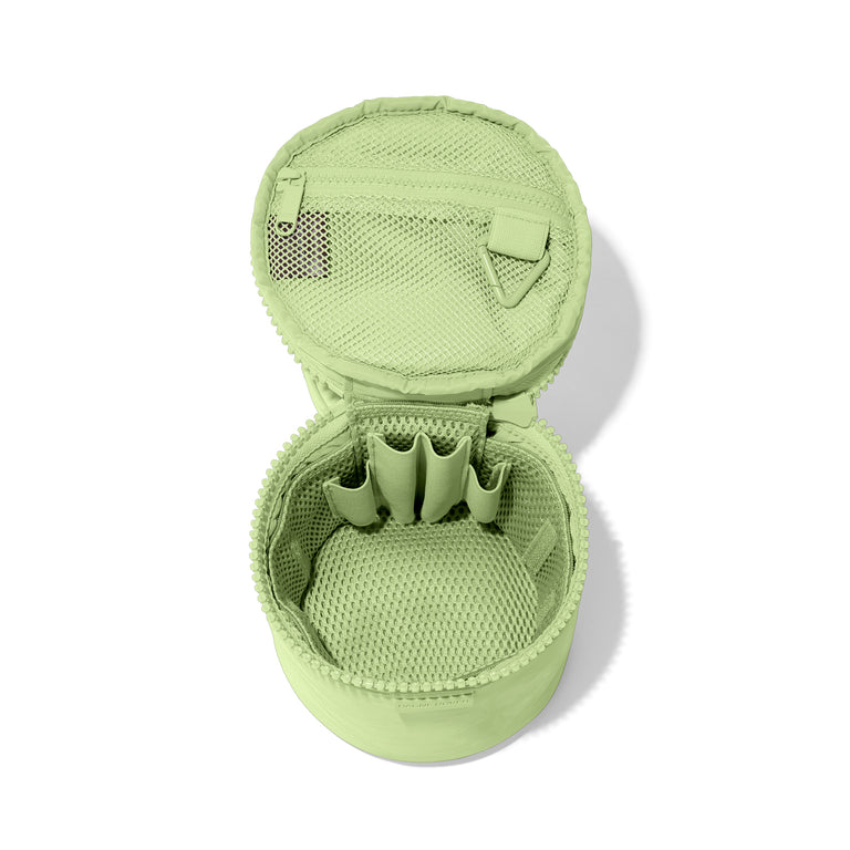 Dagne Dover small Mila Toiletry Pouch in matcha green unzipped with the removable airmesh insert.