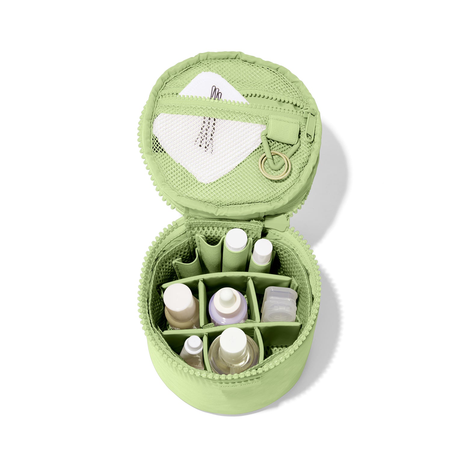 hover Dagne Dover small Mila Toiletry Pouch in matcha green unzipped filled with toiletry products.