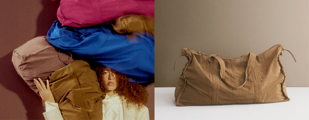 A split-screen image showing a model wearing a stack of colorful oversized soft bags on the left, and a tan duffel bag on a plain beige background on the right.