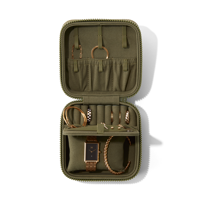 Dagne Dover Large Frankie Jewelry Case in dark green, seen open from above with jewelry inside the interior compartment.