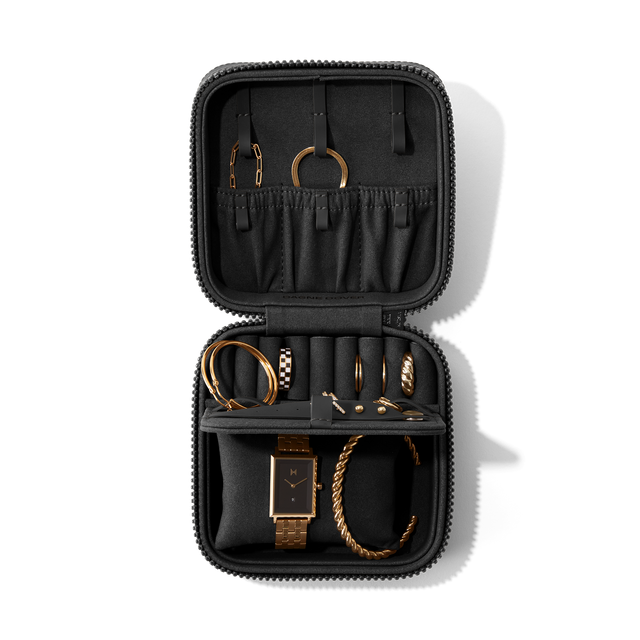 Dagne Dover Large Frankie Jewelry Case in black, seen open from above with jewelry inside the interior compartment.