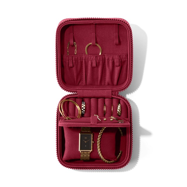 Dagne Dover Large Frankie Jewelry Case in a spice red, seen open from above with jewelry inside the interior compartment.