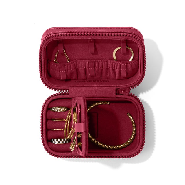 Dagne Dover Small Frankie Jewelry Case in a spice red, seen open from above with jewelry inside the interior compartment.