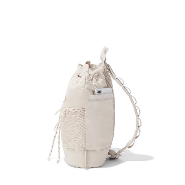 Dagne Dover Nova Sling Bag in white seen from the side.