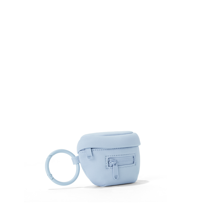Dagne Dover Ace Keychain in an airy, lighter sky blue seen from an angle.
