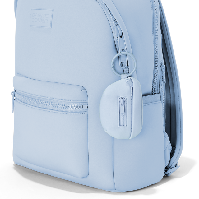 Dagne Dover Ace Keychain in an airy, lighter sky blue clipped onto a backpack. hover
