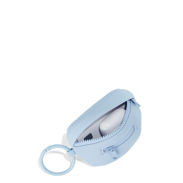 Dagne Dover Ace Keychain in an airy, lighter sky blue unzipped, showing interior.
