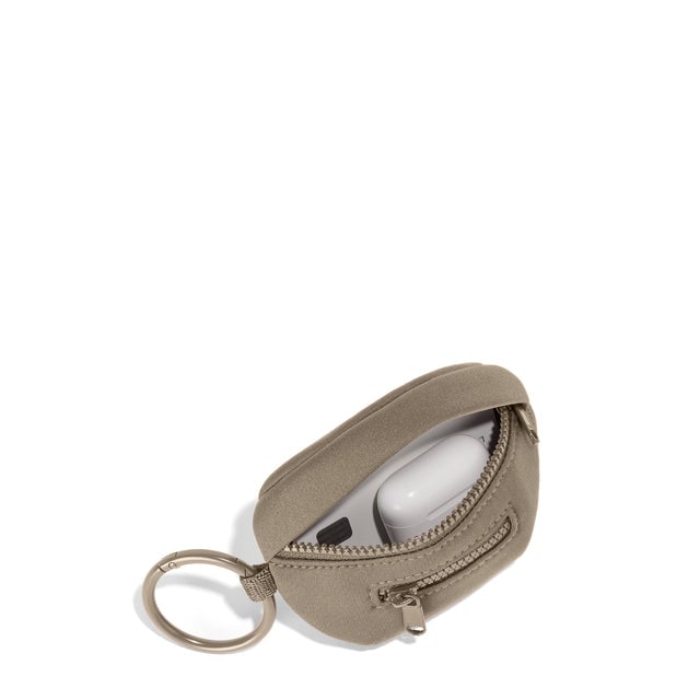 Dagne Dover Ace Keychain in a medium-dark, creamy tan unzipped, showing interior.