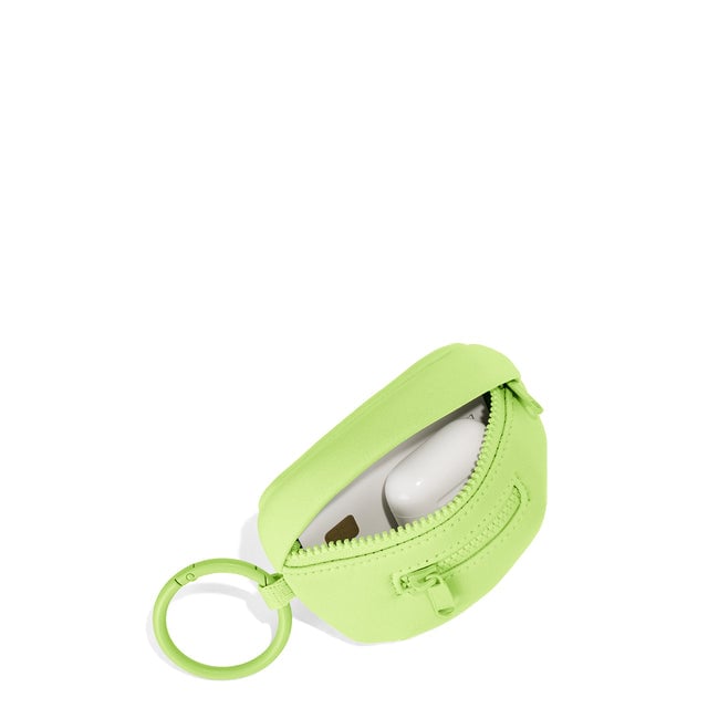 Dagne Dover Ace Keychain in a vibrant, creamy green unzipped, showing interior.