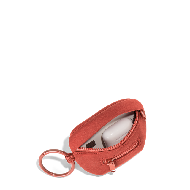 Dagne Dover Ace Keychain in a poppy, vintage wash red unzipped, showing interior.