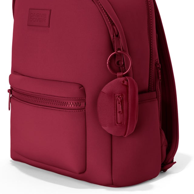 Dagne Dover Ace Keychain in a punchy, saturated deep red clipped onto a backpack. hover