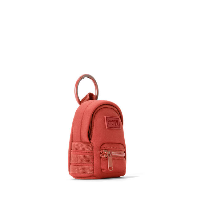 Dagne Dover Dakota Keychain in a poppy, vintage wash red seen from an angle.
