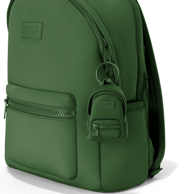 Dagne Dover Dakota Keychain in a rich, classic forest green clipped onto a backpack. hover
