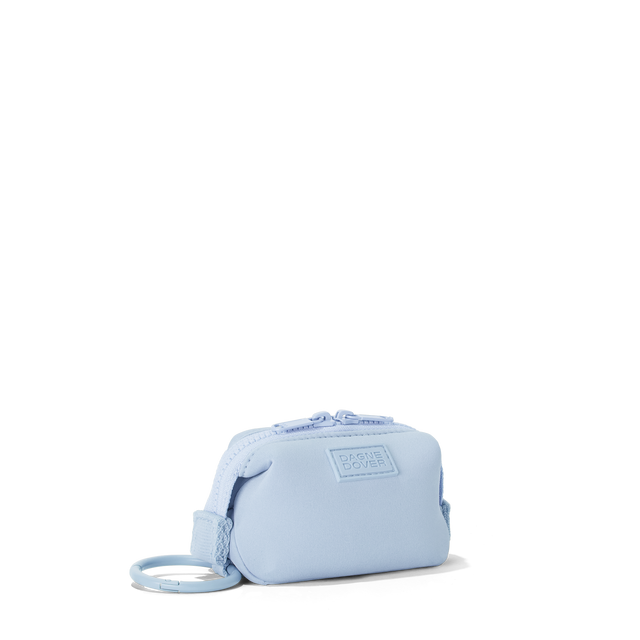 Dagne Dover Hunter Keychain in an airy, lighter sky blue seen from an angle.
