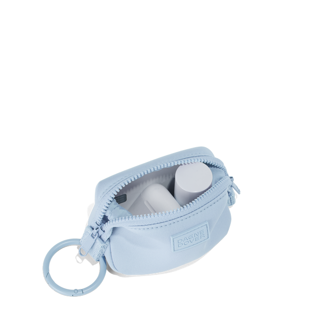 Dagne Dover Hunter Keychain in an airy, lighter sky blue unzipped, showing interior.

