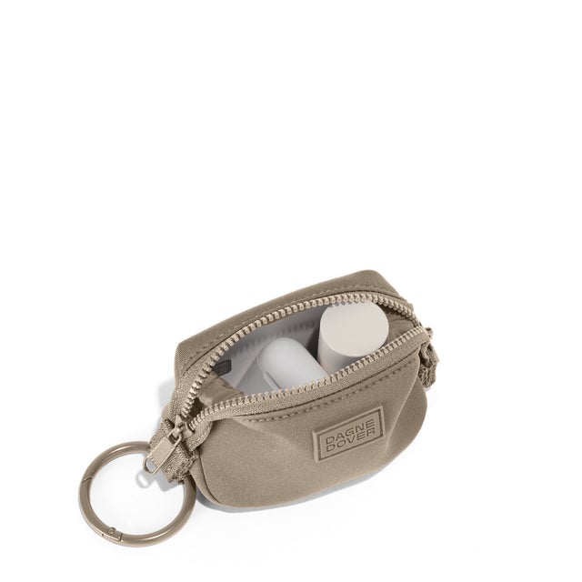 Dagne Dover Hunter Keychain in a medium-dark, creamy tan unzipped, showing interior.