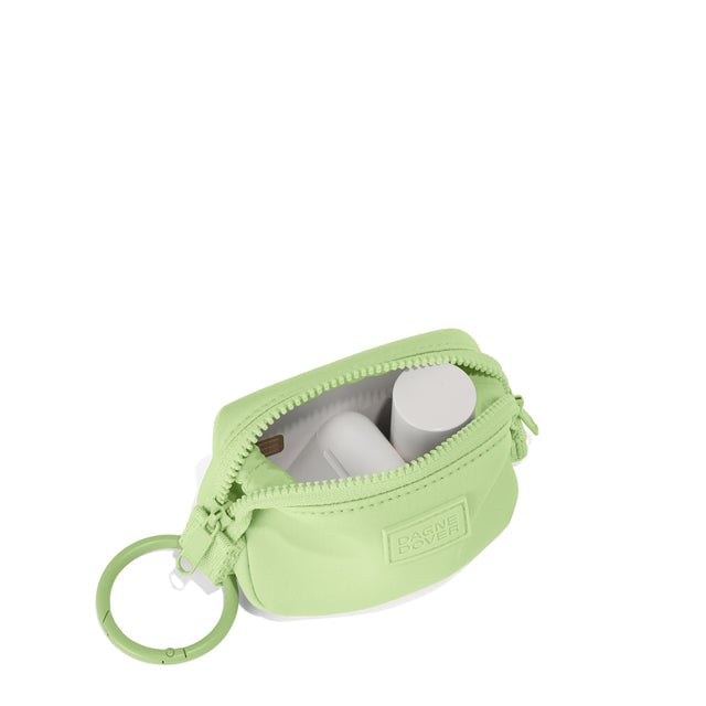 Dagne Dover Hunter Keychain in a vibrant, creamy green unzipped, showing interior.