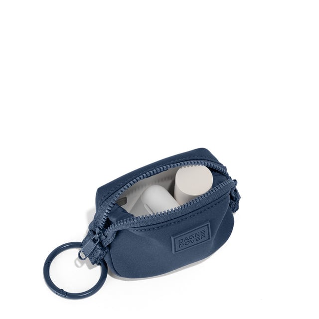 Dagne Dover Hunter Keychain in a medium grey-blue with a touch of turquoise unzipped, showing interior.
