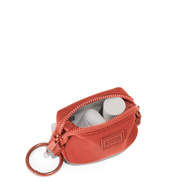 Dagne Dover Hunter Keychain in a poppy, vintage wash red unzipped, showing interior.
