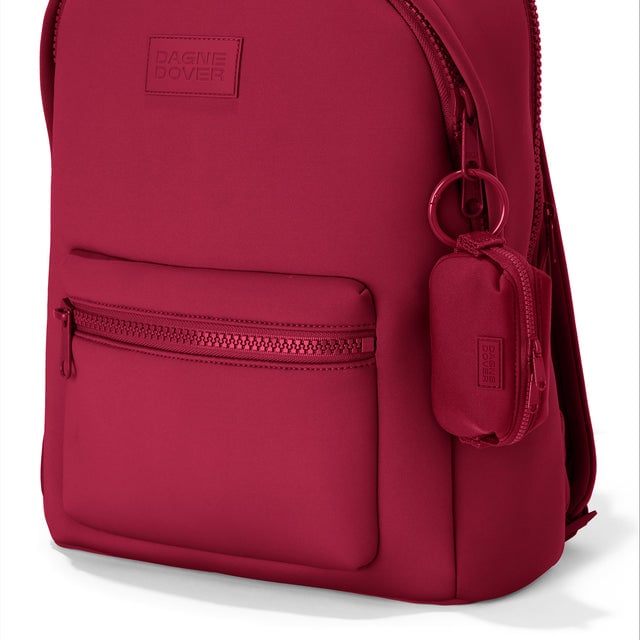 Dagne Dover Hunter Keychain in a punchy, saturated deep red clipped onto a backpack. hover