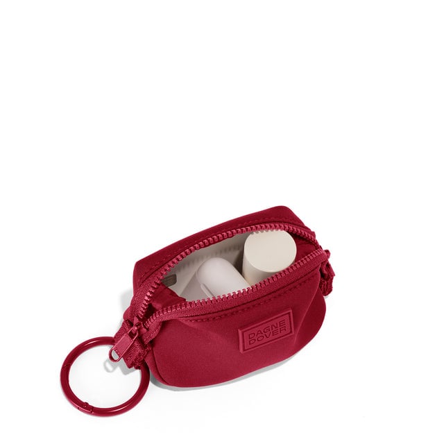 Dagne Dover Hunter Keychain in a punchy, saturated deep red unzipped, showing interior.